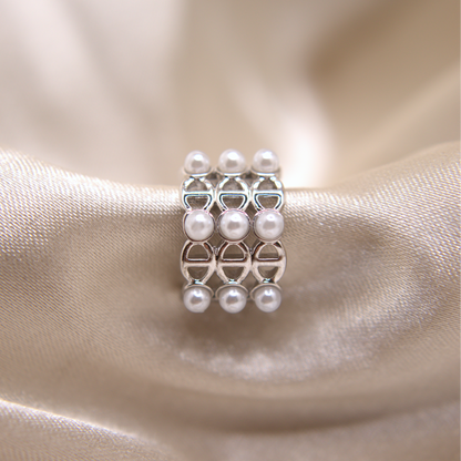 Dual-tone ear cuff in gold and silver with pearl accents.