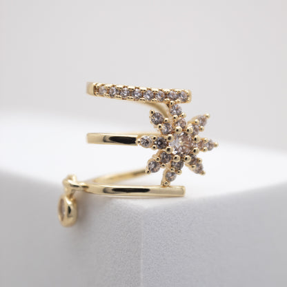 Golden ear cuff with crystal flower design