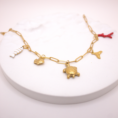 Waterproof gold necklace with turtle, coral, and marine animal pendants