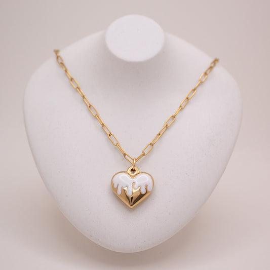 Gold heart necklace with white enamel dripping design