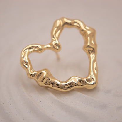 Gold organic heart stud earrings with irregular sculptural texture