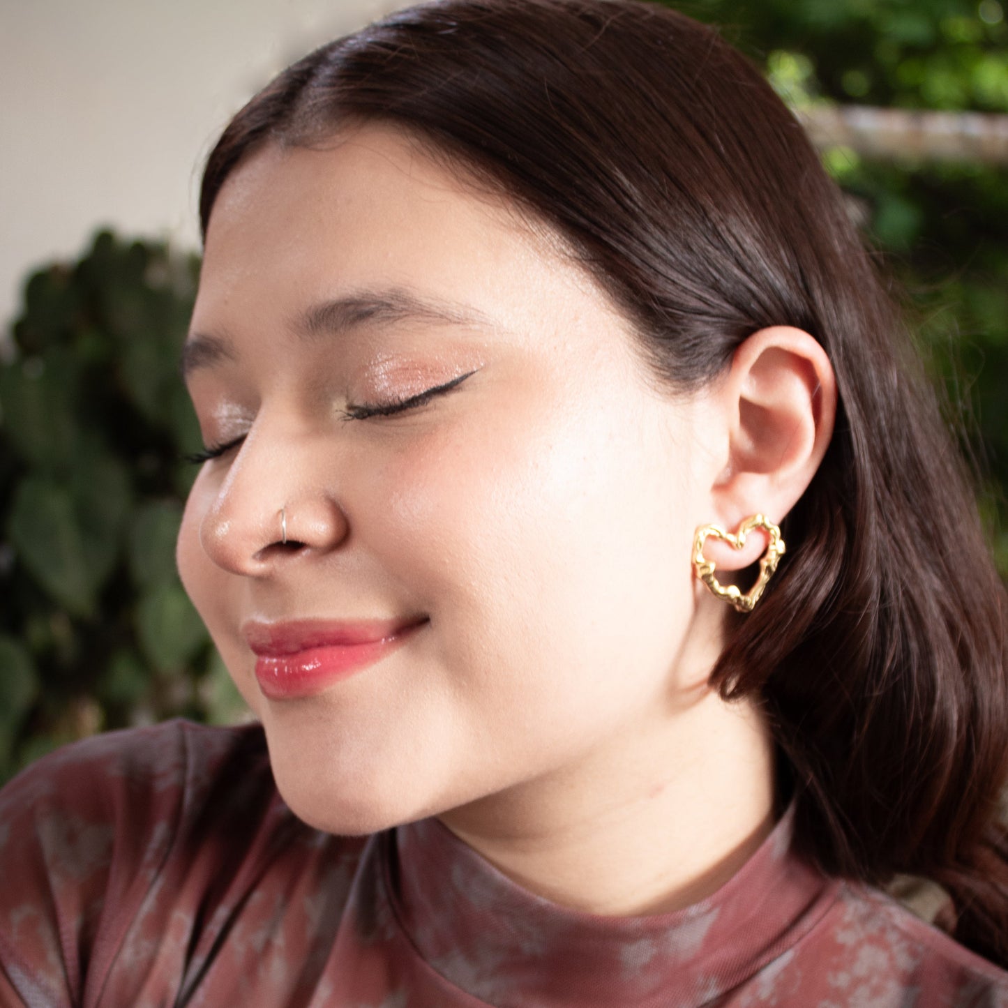 Textured gold heart stud earrings inspired by organic forms