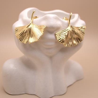 Elegant gold earrings inspired by ocean breeze and coastal beauty.